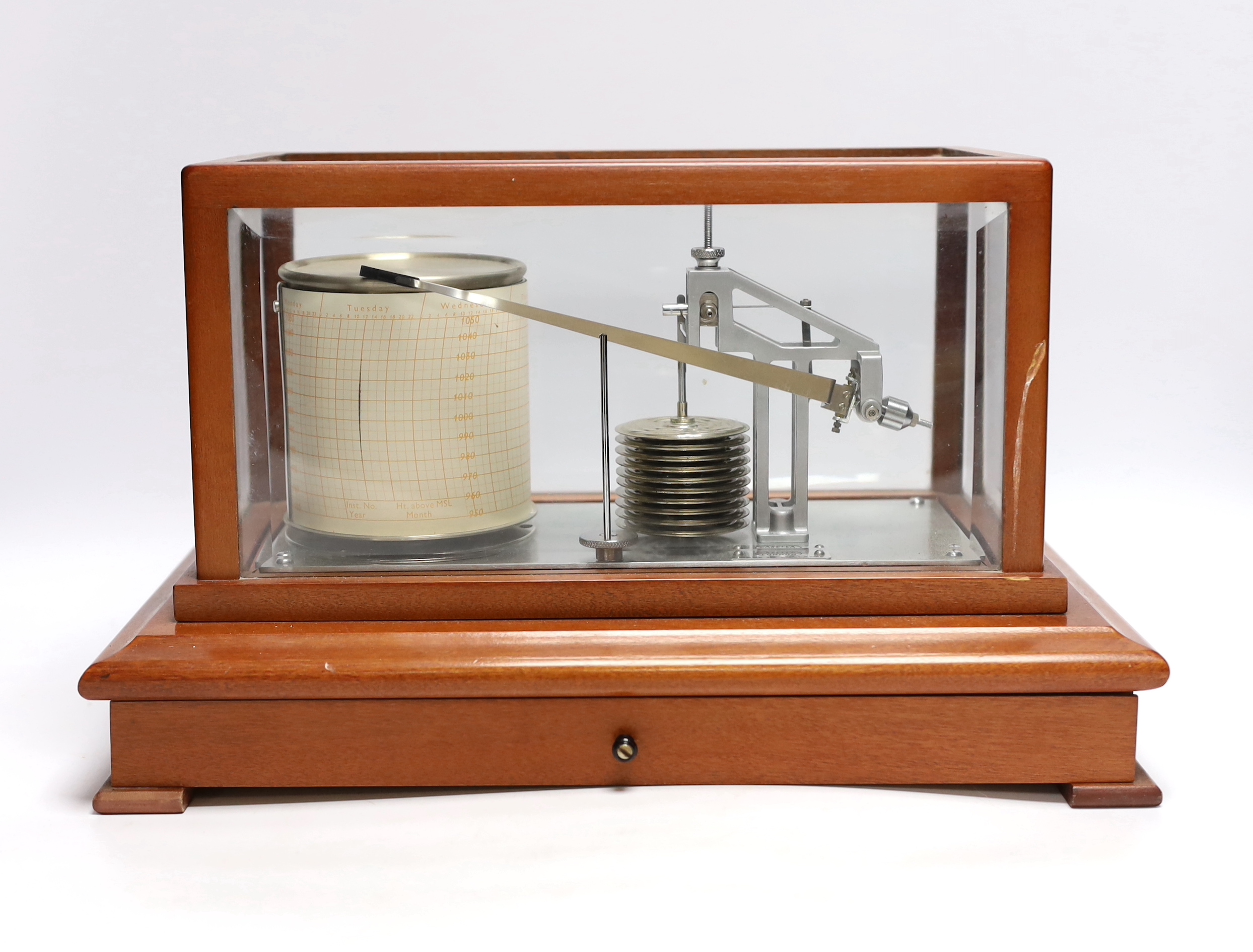 A modern 1980s barograph by Casella in a teak case with bevelled glass panels and incorporating a drawer with spare graph papers, 37cm x 24cm
